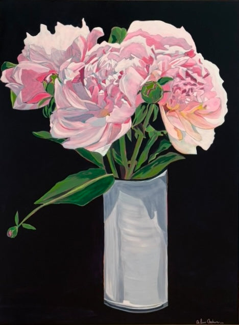 Pink flowers in a clear vase on a black background